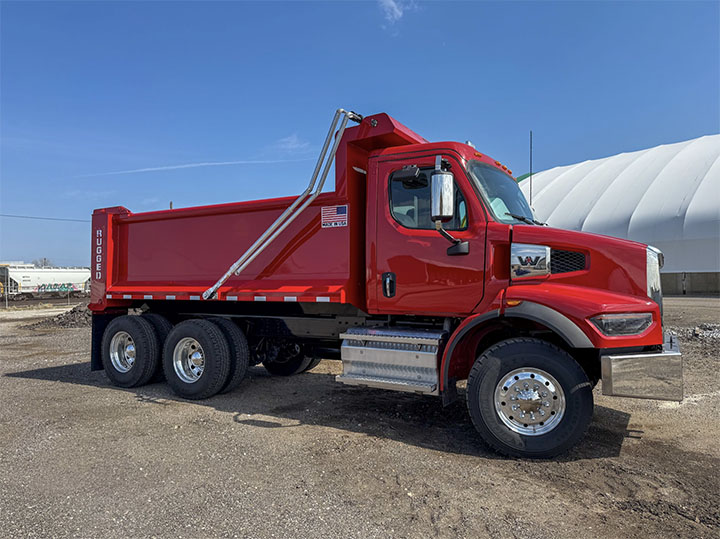 Rugged dump body on a tandem axle truck